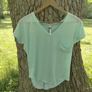 POOF Tee shirt in size M